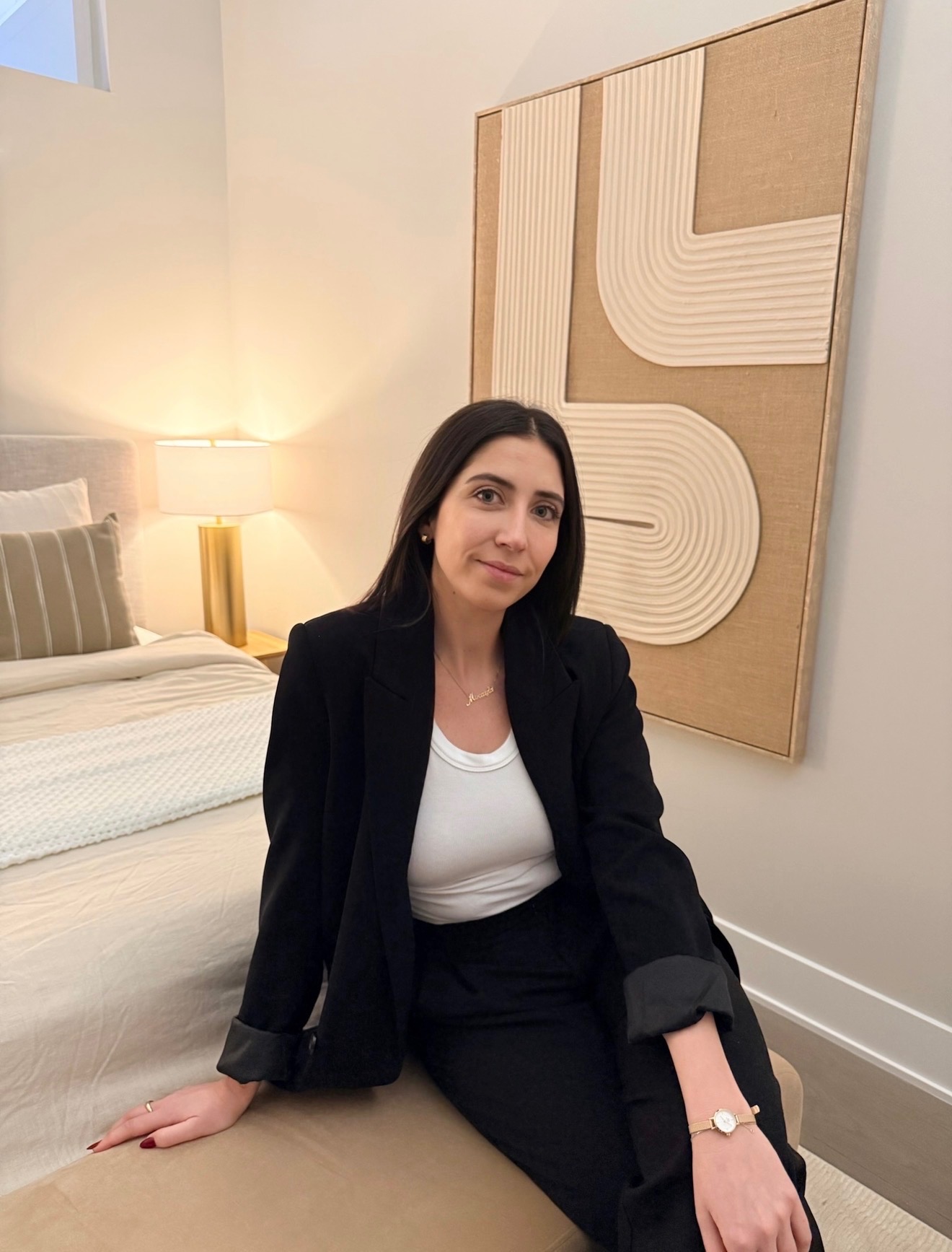 Miceala, founder of Studio Ikos, in a staged bedroom